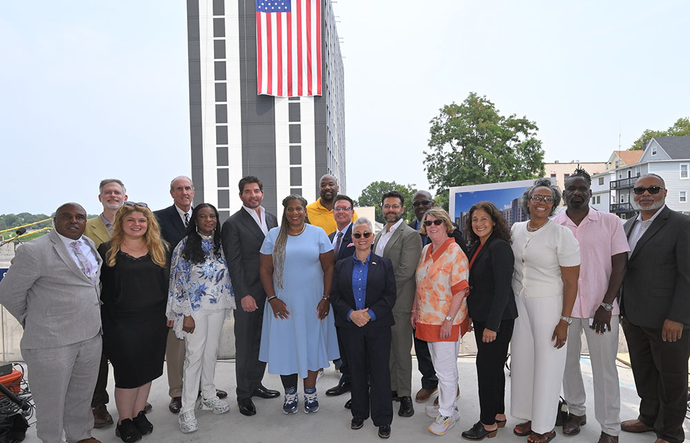 Topping off held for QWest Towers, a new $158 million workforce housing development in Mount Vernon